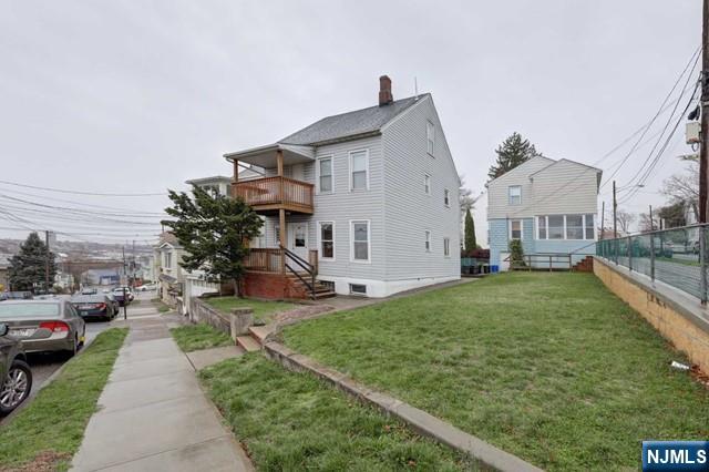 58 Westervelt Avenue, Unit 1 Hawthorne, NJ 07506 - Photo 13 of 17 a view of a front of house with a yard