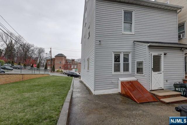 58 Westervelt Avenue, Unit 1 Hawthorne, NJ 07506 - Photo 16 of 17 a view of a house with a yard