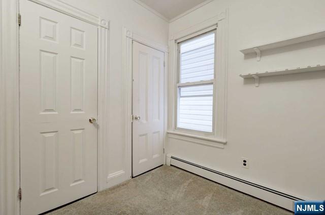 58 Westervelt Avenue, Unit 1 Hawthorne, NJ 07506 - Photo 8 of 17 a view of an empty room with a window