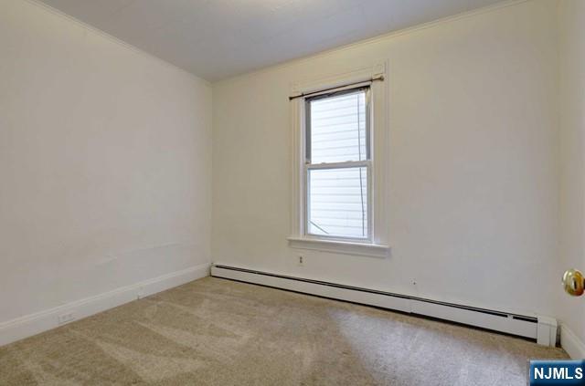 58 Westervelt Avenue, Unit 1 Hawthorne, NJ 07506 - Photo 10 of 17 an empty room with a window