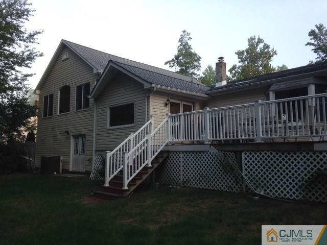 75 Rieder Road Spotswood, NJ 08884 - Photo 2 of 15 a view of a deck with a yard