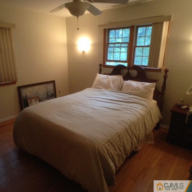 75 Rieder Road Spotswood, NJ 08884 - Photo 11 of 15 a large bed sitting in a bedroom next to a window