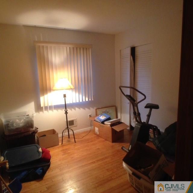 75 Rieder Road Spotswood, NJ 08884 - Photo 12 of 15 a room with gym equipment and a window