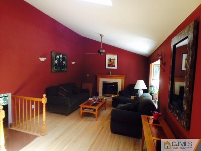 75 Rieder Road Spotswood, NJ 08884 - Photo 3 of 15 a living room with furniture and a fireplace