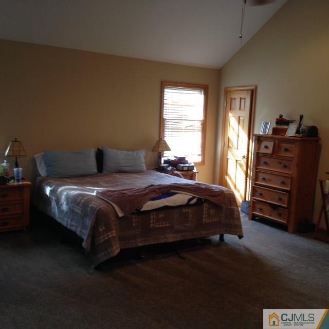 75 Rieder Road Spotswood, NJ 08884 - Photo 8 of 15 a bedroom with a bed and two windows