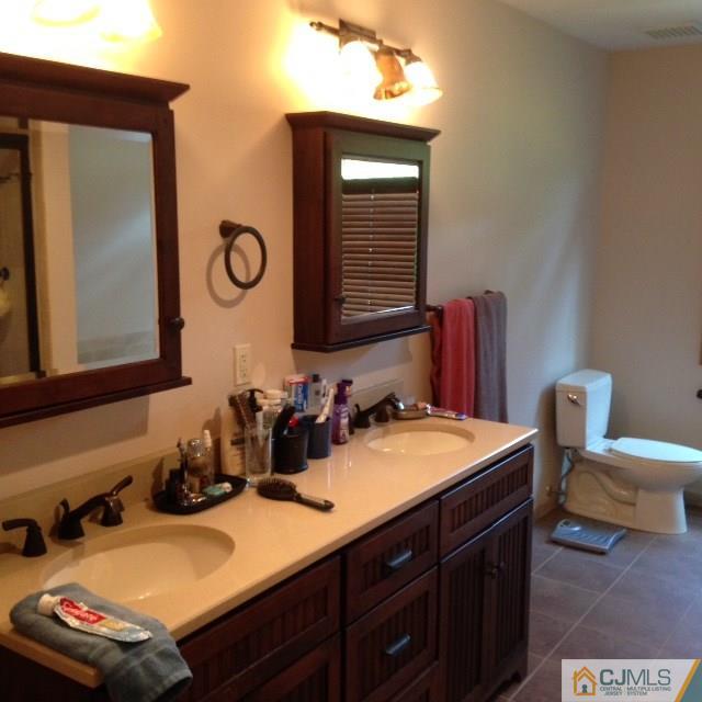 75 Rieder Road Spotswood, NJ 08884 - Photo 9 of 15 a bathroom with a sink and a mirror