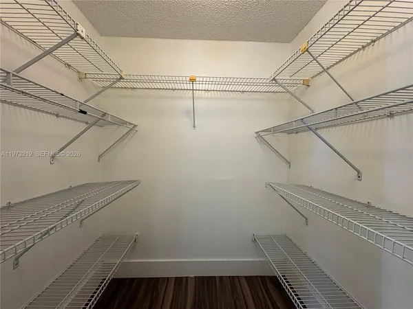 a view of a room with racks on the wall