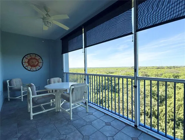 a view of roof deck with furniture and garden