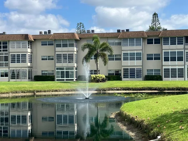 a view of a building with a yard