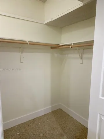 a bathroom with a sink vanity and a mirror