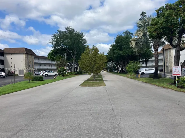 a view of a lake with a house in the background