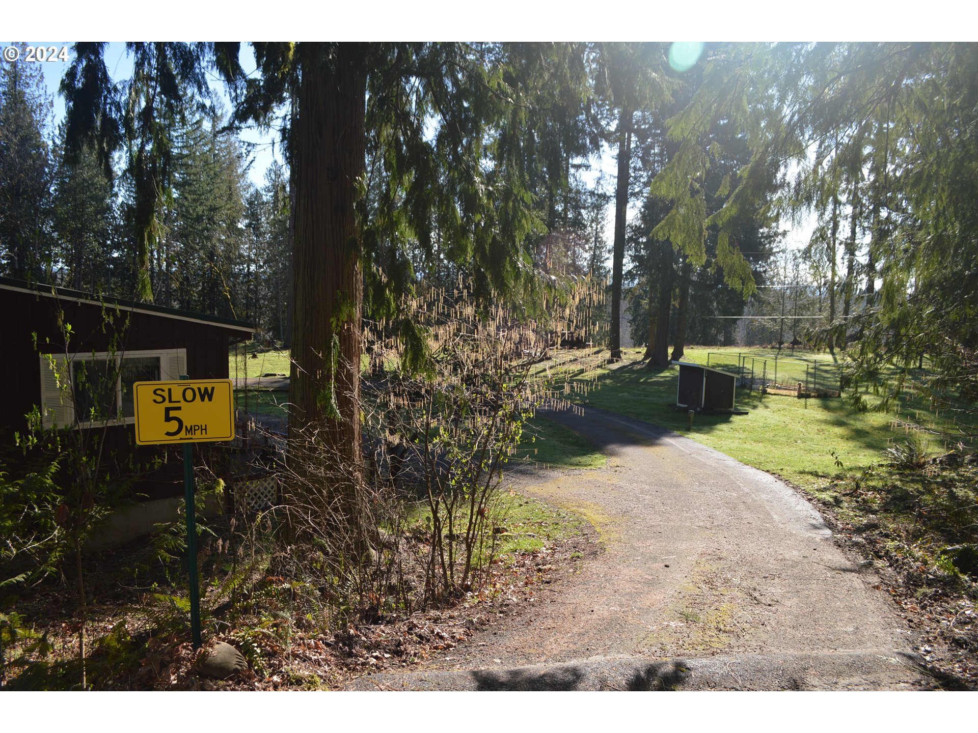 17524 South Palmer Road Oregon City, OR 97045 - Photo 3 of 26 a backyard of a house with a yard and outdoor seating