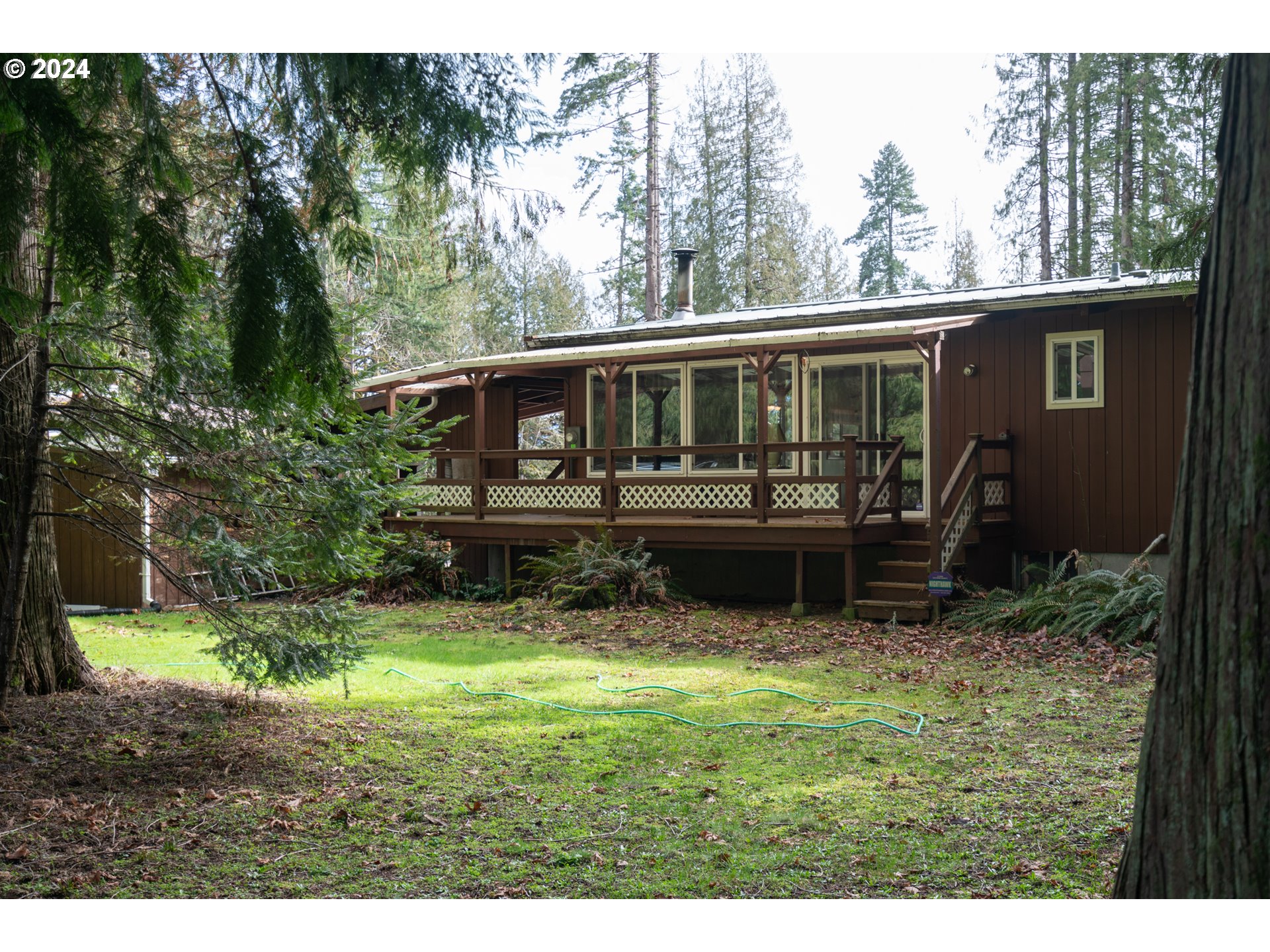 17524 South Palmer Road Oregon City, OR 97045 - Photo 9 of 26 a view of a house with yard and sitting area