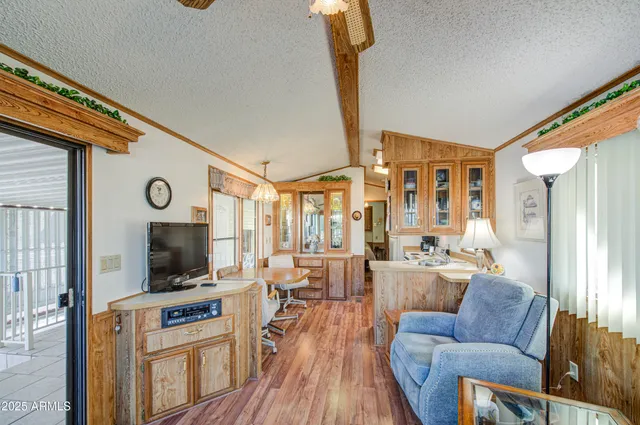 a living room with furniture flat screen tv and a fireplace