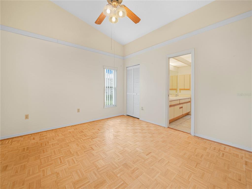 6011 Condor Drive Lakeland, FL 33809 - Photo 12 of 26 an empty room with windows and fan