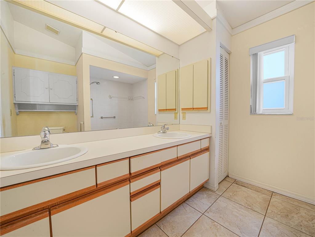 6011 Condor Drive Lakeland, FL 33809 - Photo 15 of 26 a bathroom with a sink and a mirror