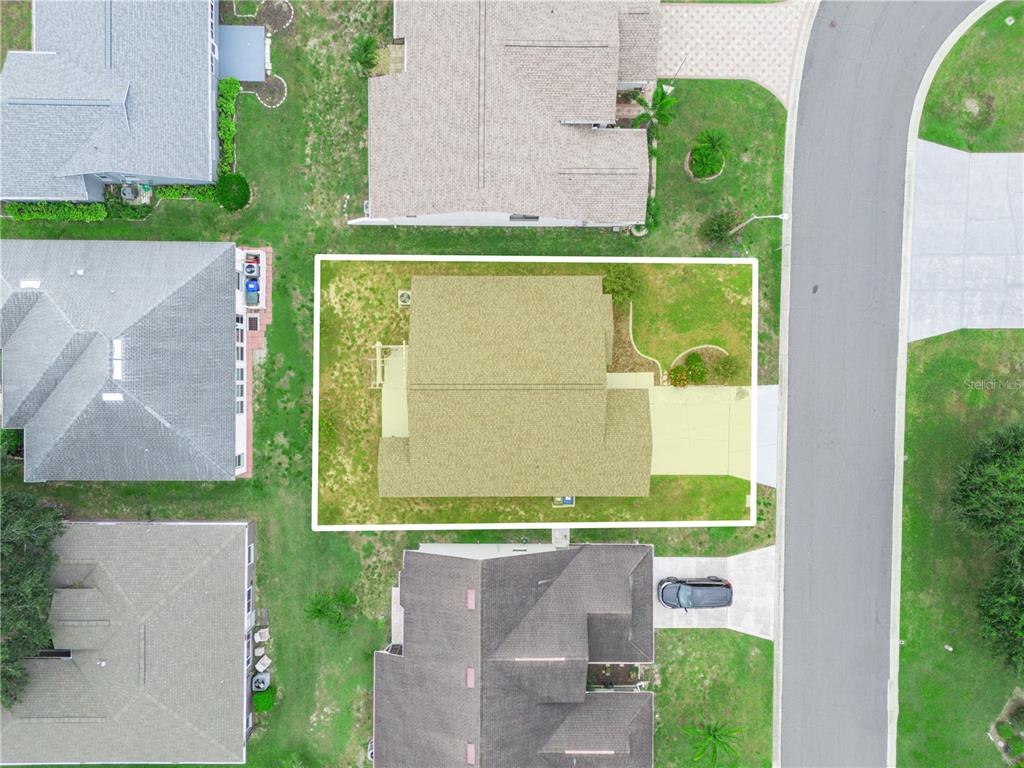 6011 Condor Drive Lakeland, FL 33809 - Photo 22 of 26 an aerial view of a residential houses with outdoor space and a lake view