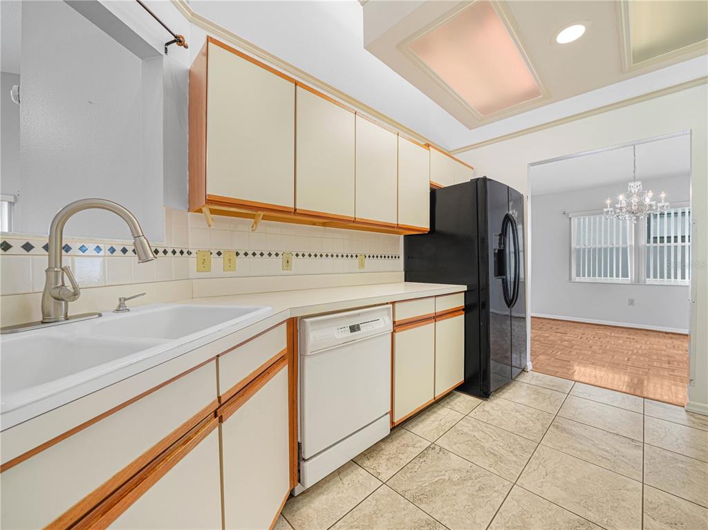 6011 Condor Drive Lakeland, FL 33809 - Photo 6 of 26 a kitchen with a sink cabinets and stainless steel appliances