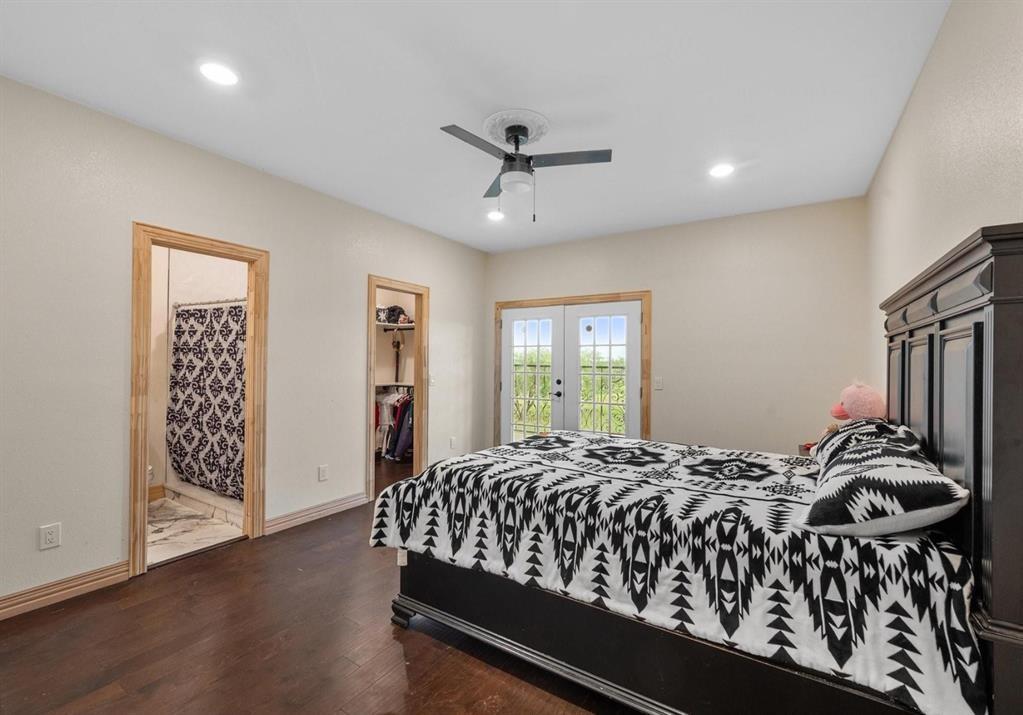 6051 County Road 1030 B Rice, TX 75155 - Photo 11 of 23 a bedroom with a bed next to a window