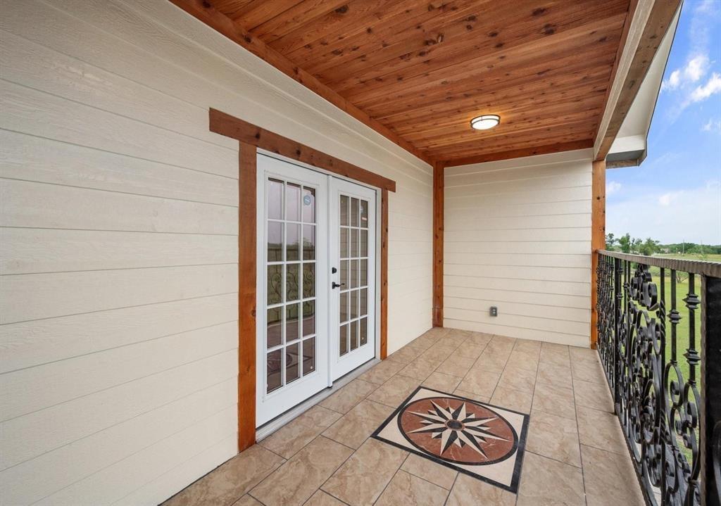 6051 County Road 1030 B Rice, TX 75155 - Photo 12 of 23 a view of a door and wooden floor