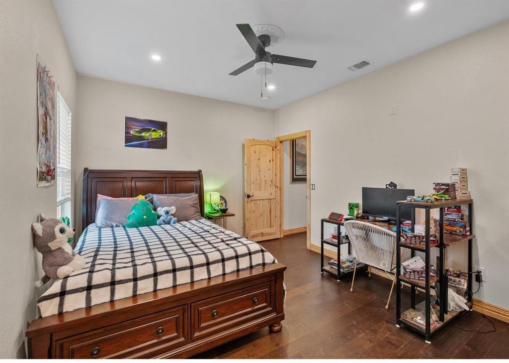 6051 County Road 1030 B Rice, TX 75155 - Photo 14 of 23 a bedroom with a bed and a desk