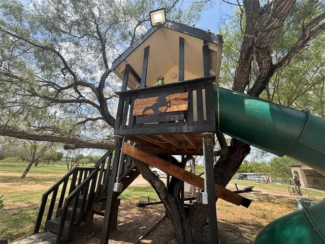 a view of a city with tall trees
