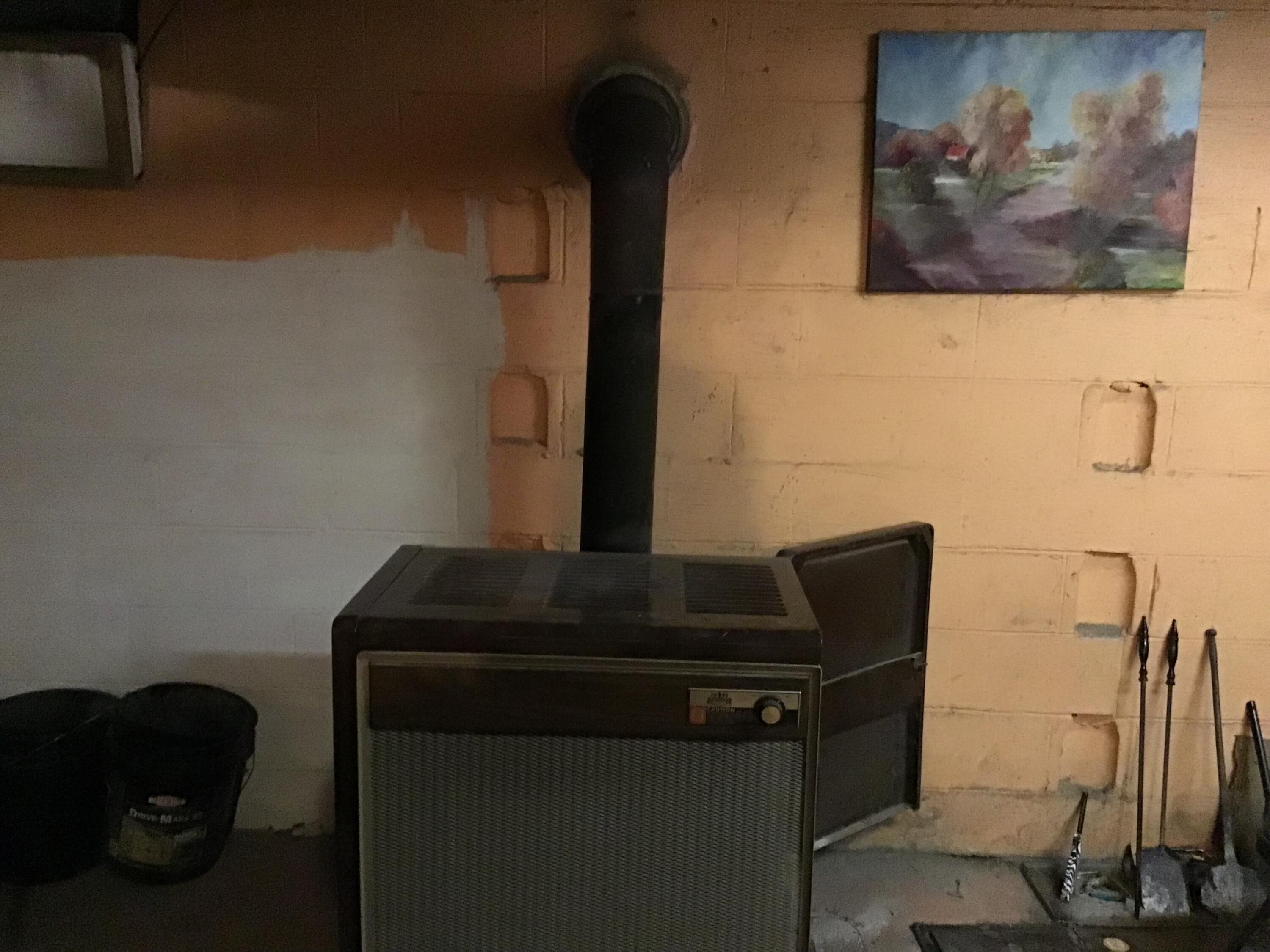 8148 Fairview Road Duffield, VA 24244 - Photo 28 of 38 WOODSTOVE IN BASEMENT