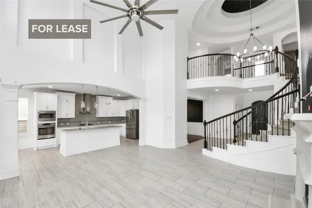 a view of a living room and kitchen
