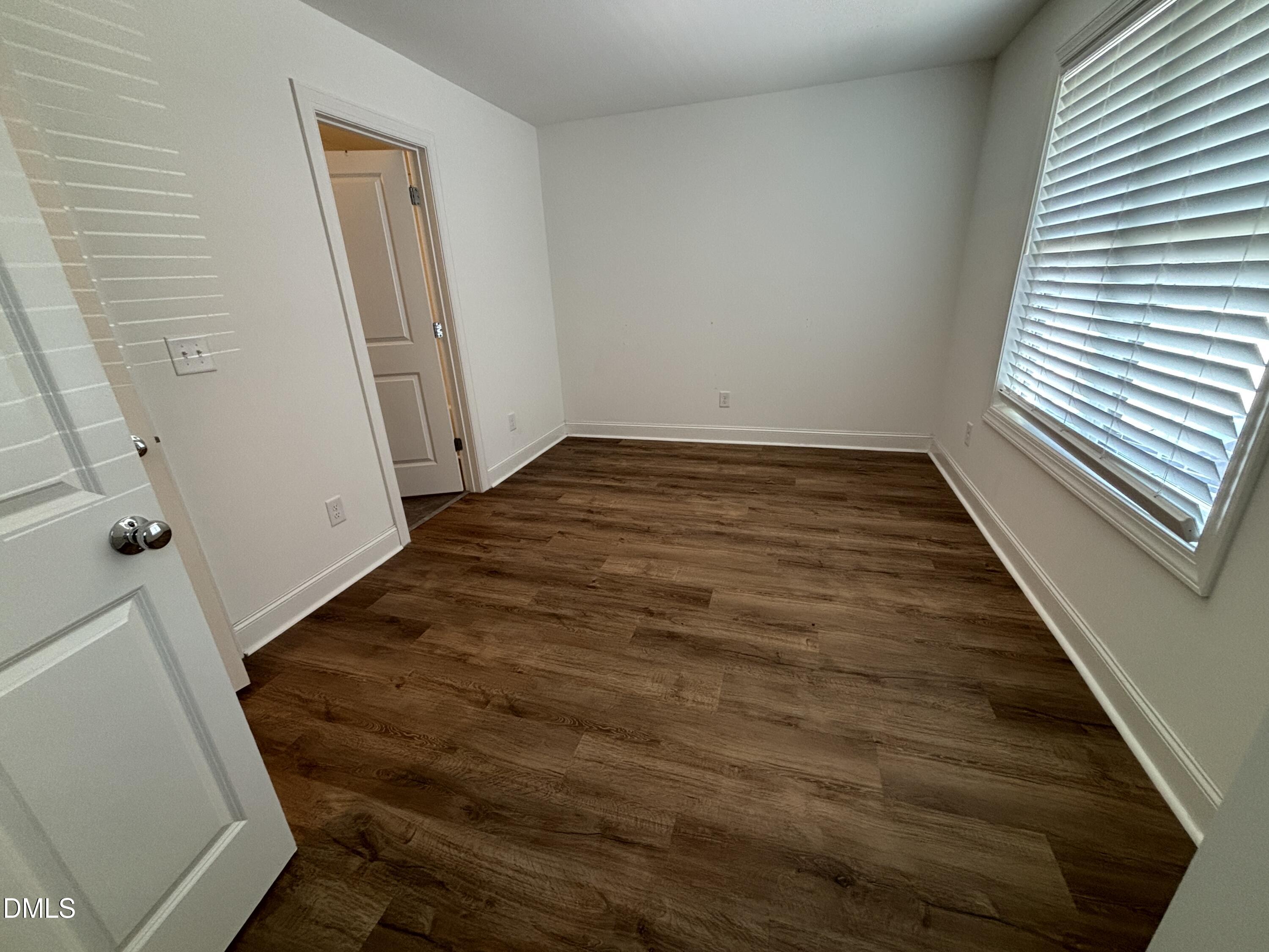 5710 Parker Pnes Court Raleigh, NC 27609 - Photo 64 of 78 a view of a room with wooden floor and white walls