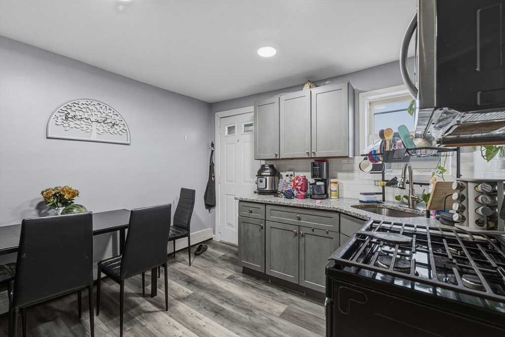 144 Choate Street Fall River, MA 02723 - Photo 17 of 42 a kitchen with a table and chairs in it