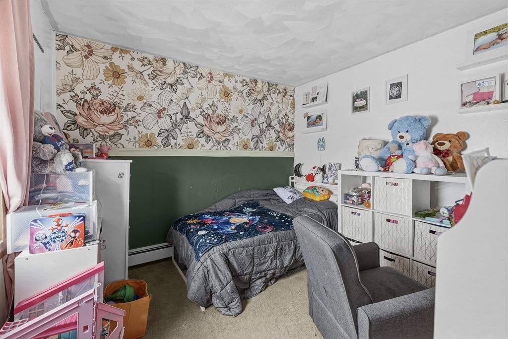 144 Choate Street Fall River, MA 02723 - Photo 19 of 42 a living room with furniture and a table