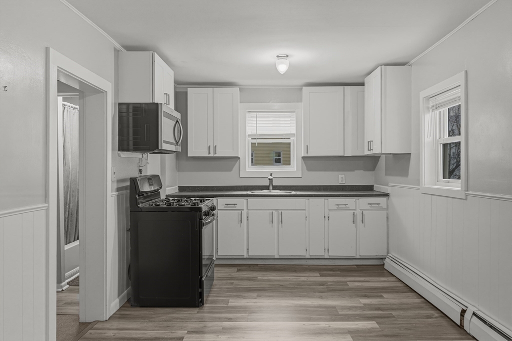 144 Choate Street Fall River, MA 02723 - Photo 26 of 42 a kitchen with stainless steel appliances granite countertop a refrigerator stove top oven and sink