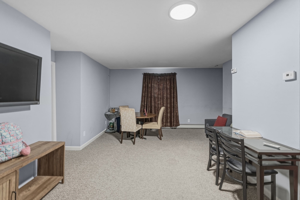 144 Choate Street Fall River, MA 02723 - Photo 31 of 42 a workspace with furniture and window