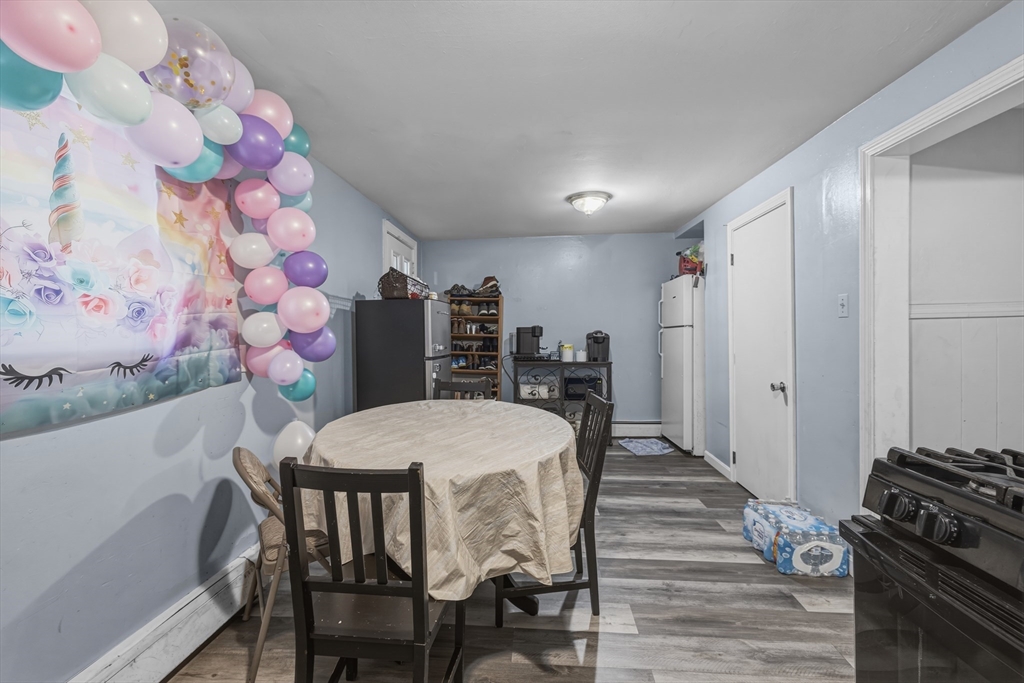 144 Choate Street Fall River, MA 02723 - Photo 41 of 42 a view of a dining room with furniture and wooden floor