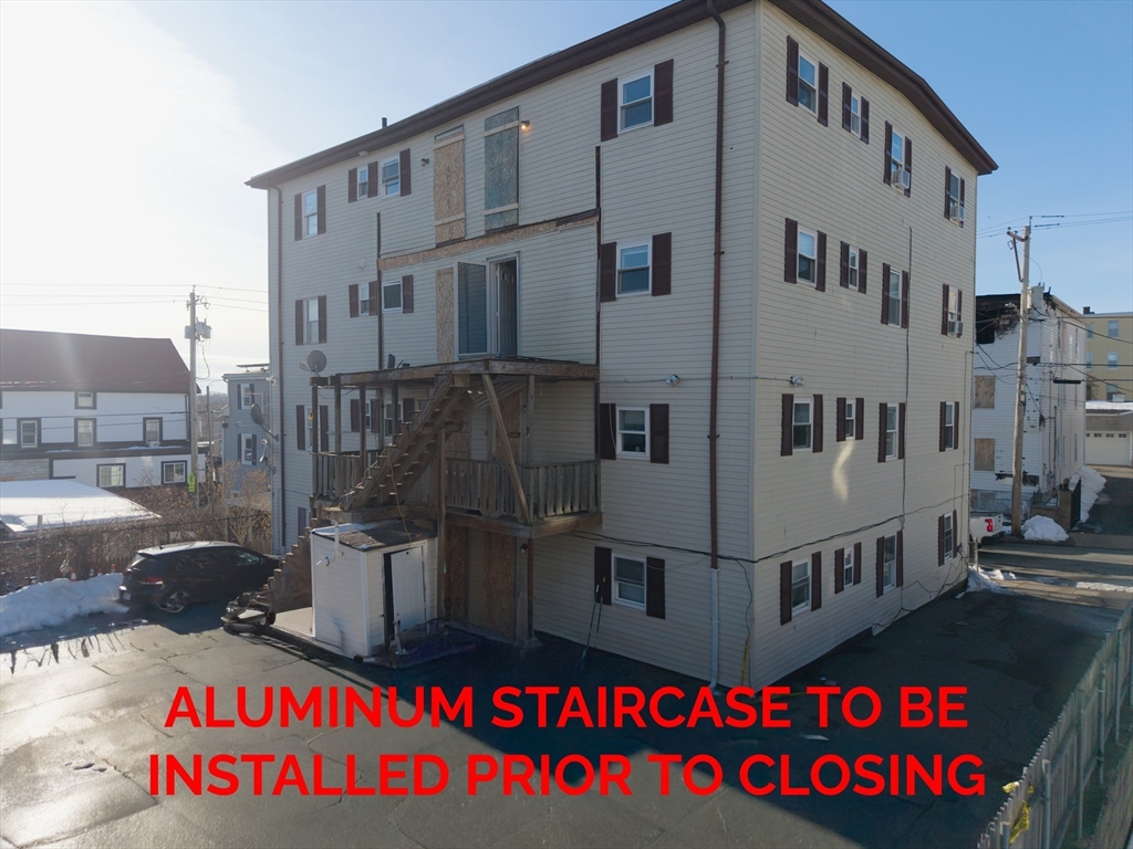 144 Choate Street Fall River, MA 02723 - Photo 7 of 42 a view of building with glass windows