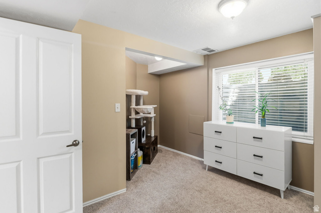 1101 Old Dairy Road Sandy, UT 84094 - Photo 19 of 36 Carpeted room featuring a double-paned window with horizontal blinds, neutral wall paint, and white baseboards