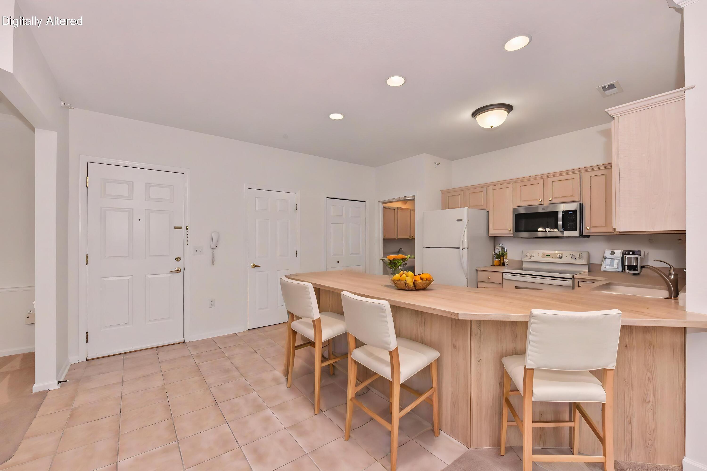 13050 West Bluemound Road, Unit 203 Elm Grove, WI 53122 - Photo 2 of 24 Bright streamlined kitchen with breakfast counter (virtual image)