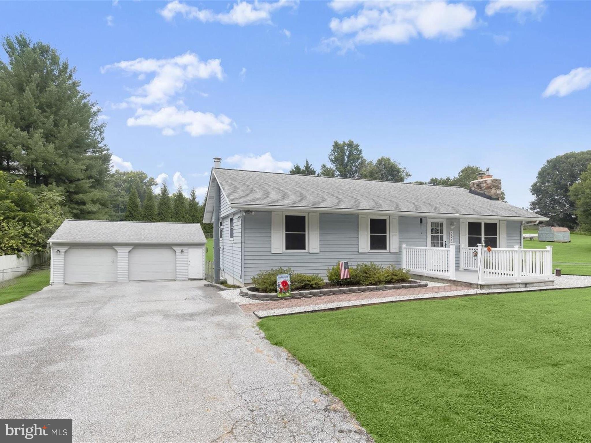 3044 Old Gamber Road Finksburg, MD 21048 - Photo 21 of 33 a front view of a house with a garden and yard