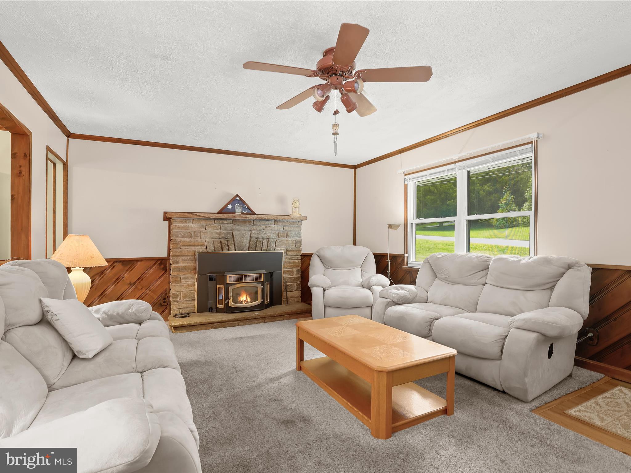 3044 Old Gamber Road Finksburg, MD 21048 - Photo 5 of 33 a living room with furniture a fireplace and a large window