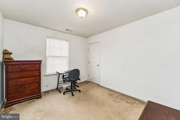 a view of a workspace with furniture