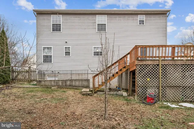 a view of house with wooden fence