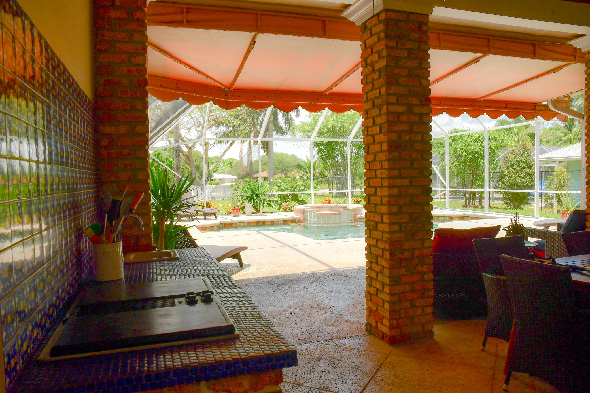 18263 River Oaks Drive Jupiter, FL 33458 - Photo 20 of 24 a view of living room with a floor to ceiling window and wooden floor