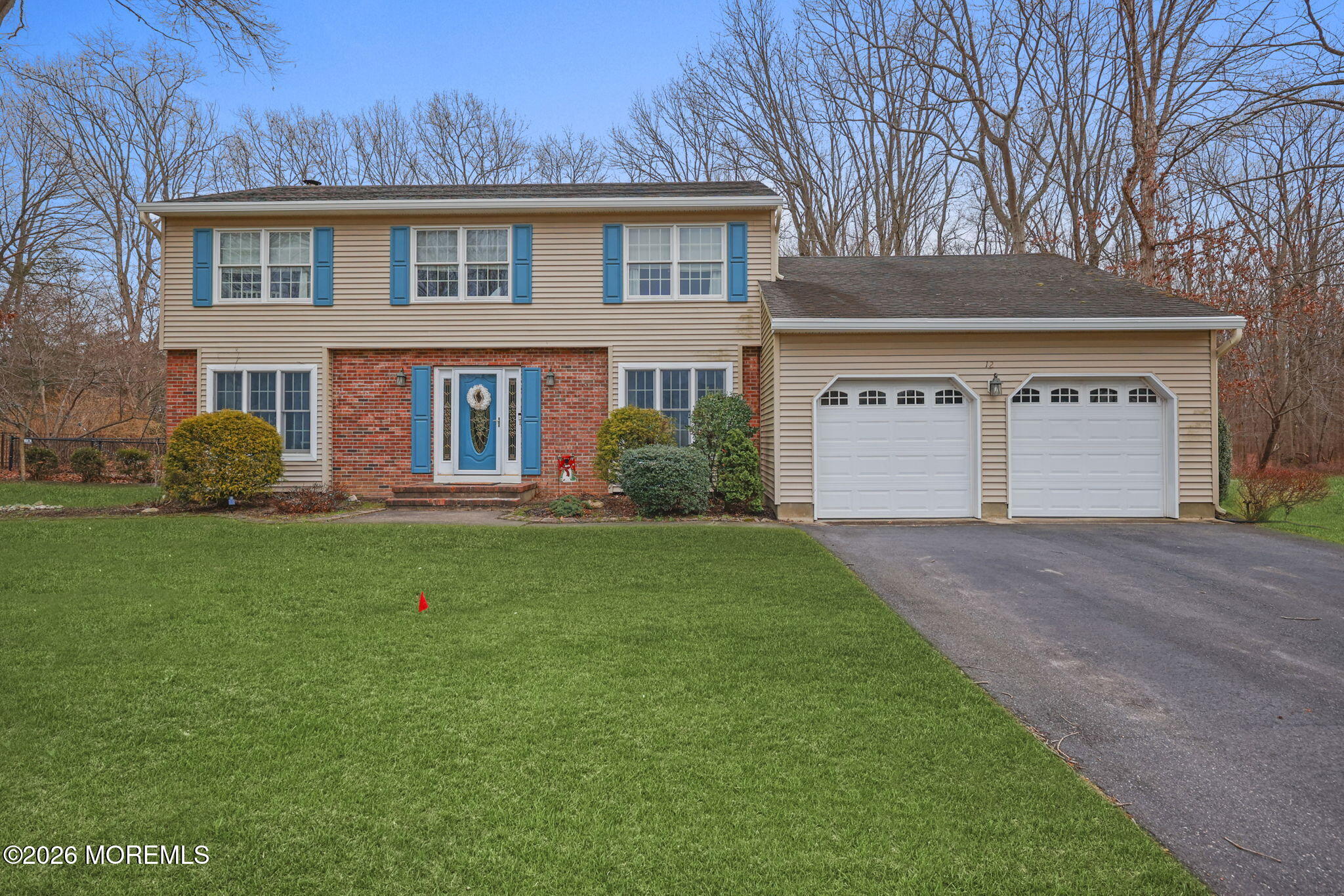 12 Rimwood Lane Howell, NJ 07731 - Photo 1 of 34 a front view of a house with garden