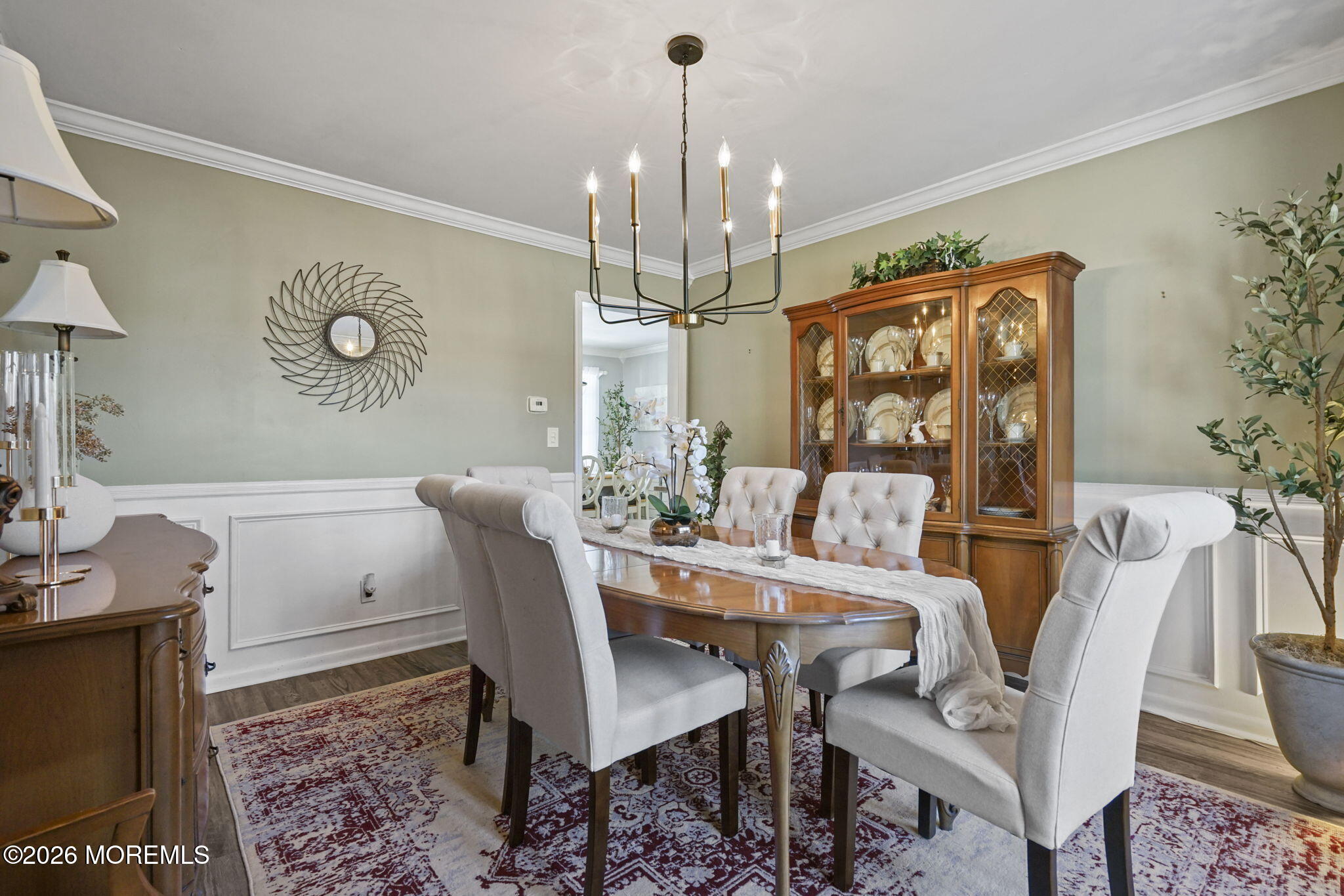 12 Rimwood Lane Howell, NJ 07731 - Photo 14 of 34 a dining room with furniture a chandelier and wooden floor