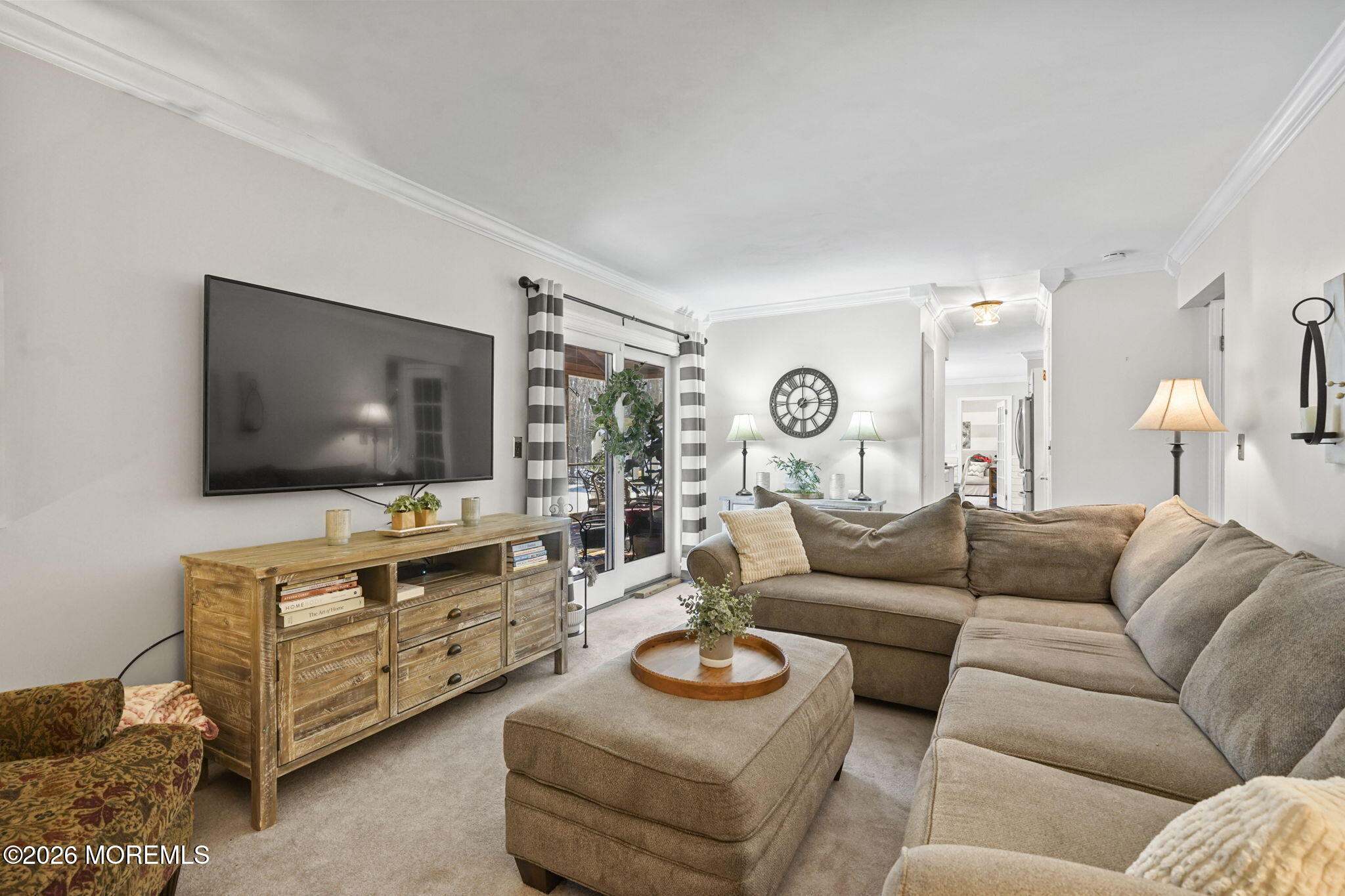 12 Rimwood Lane Howell, NJ 07731 - Photo 15 of 34 a living room with furniture and a flat screen tv