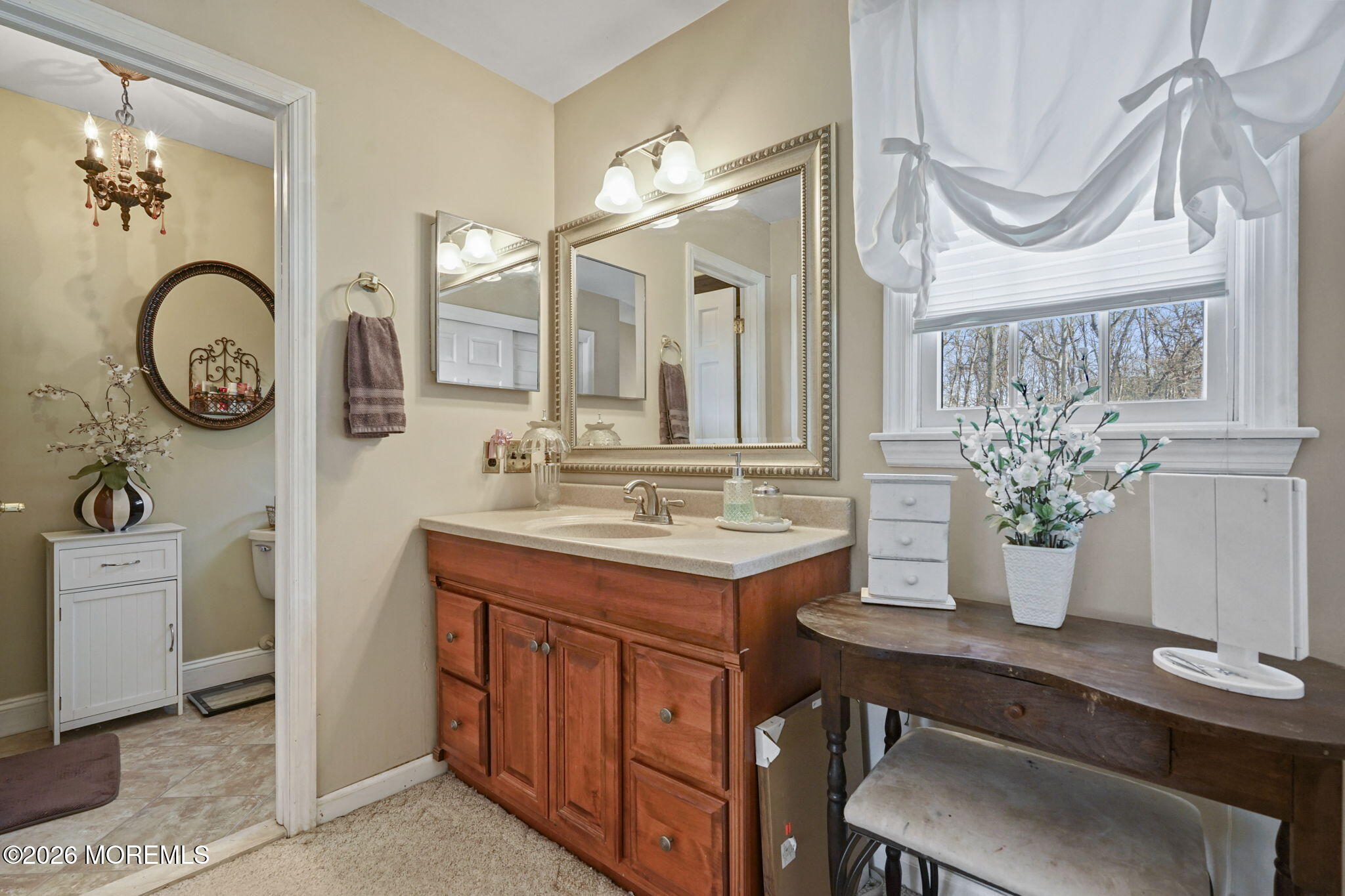 12 Rimwood Lane Howell, NJ 07731 - Photo 18 of 34 a bathroom with a granite countertop sink and a mirror