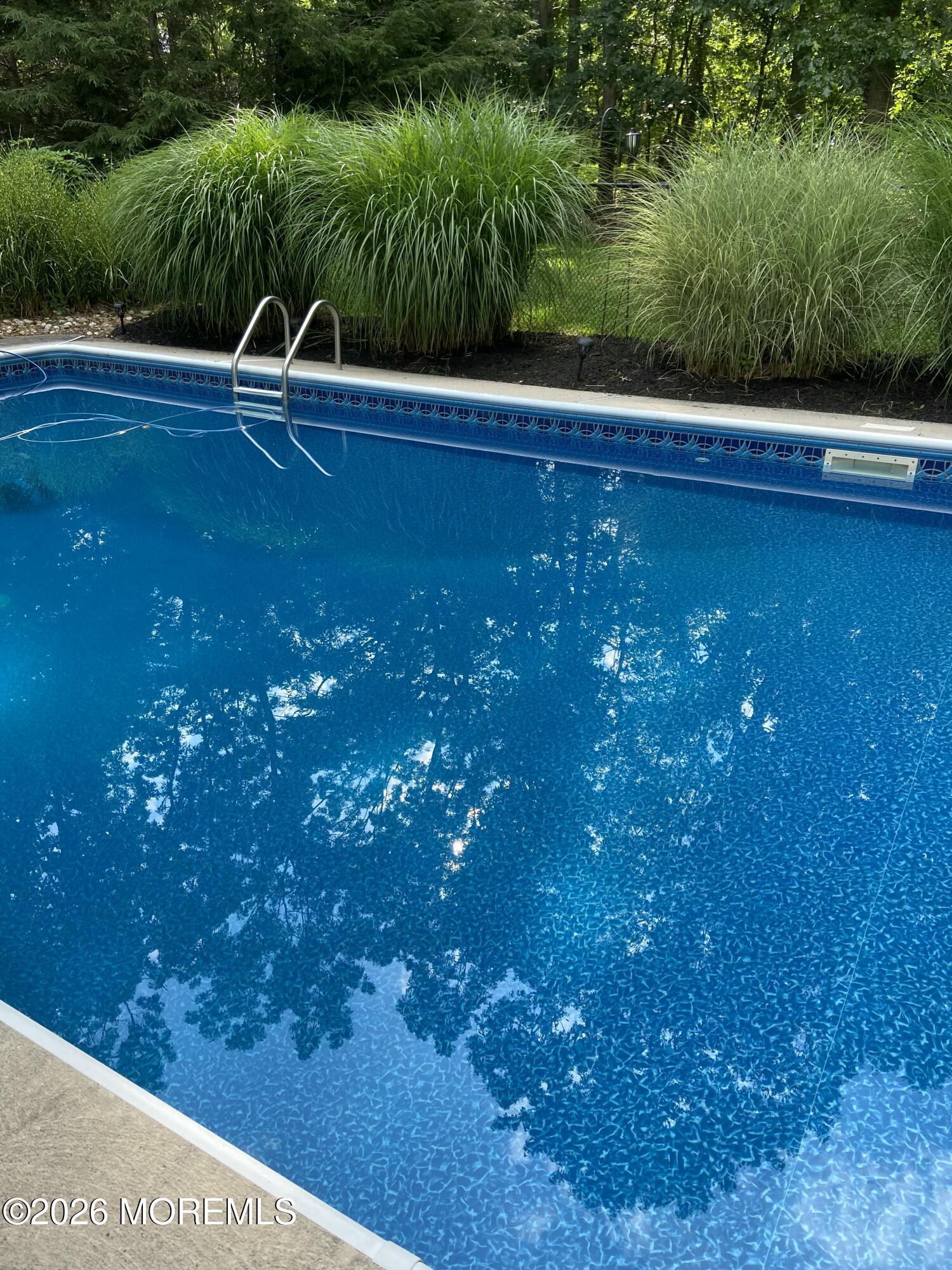 12 Rimwood Lane Howell, NJ 07731 - Photo 34 of 34 a view of swimming pool from a window