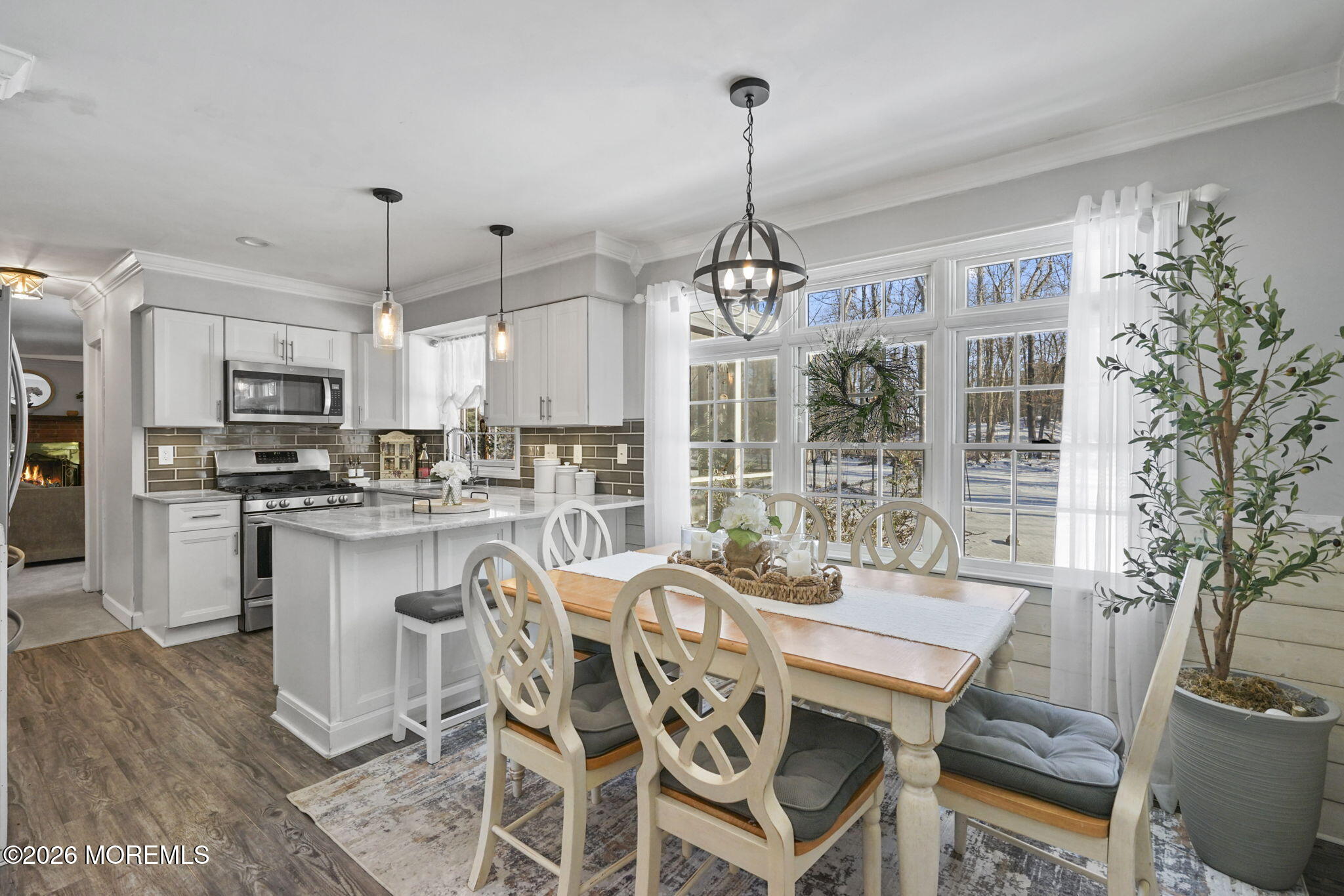 12 Rimwood Lane Howell, NJ 07731 - Photo 7 of 34 a view of a dining room with furniture large window and wooden floor