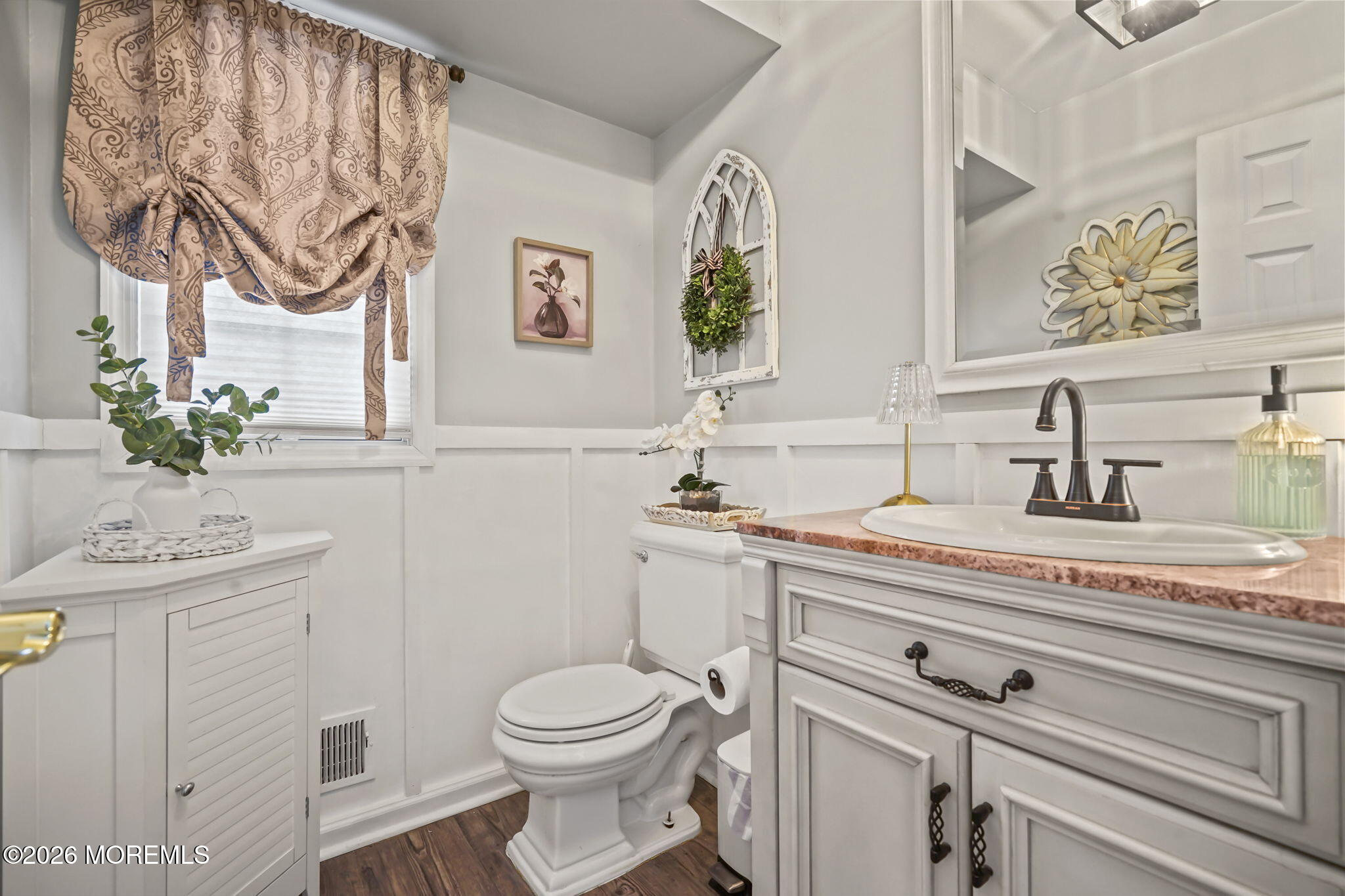 12 Rimwood Lane Howell, NJ 07731 - Photo 9 of 34 a bathroom with a sink a toilet and mirror
