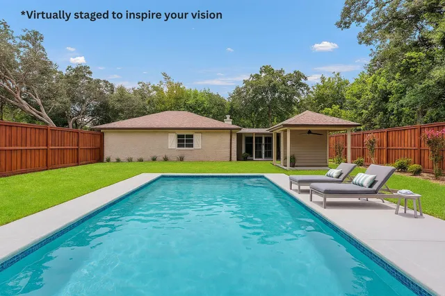 a view of a house with a yard and sitting area